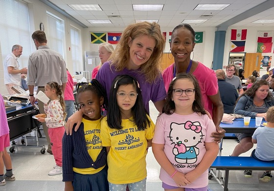 Two teachers with Student Ambassadors who helped with the Kindergarten Breakfast Bites