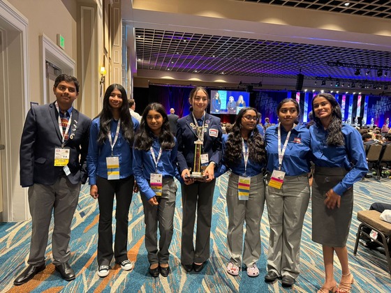 TSA students with a trophy