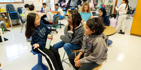 5th grade students turn and talk to their neighbor about a prompt