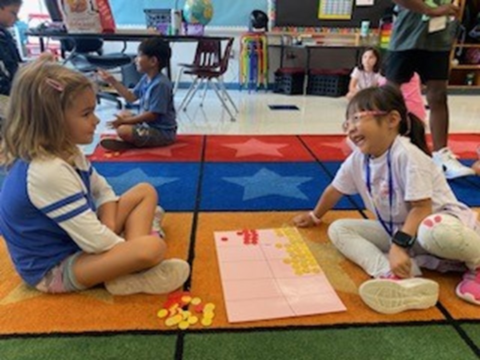 Students working as partners with math manipulatives