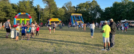 View of the Read-a-thon celebration inflatable amusements and food trucks