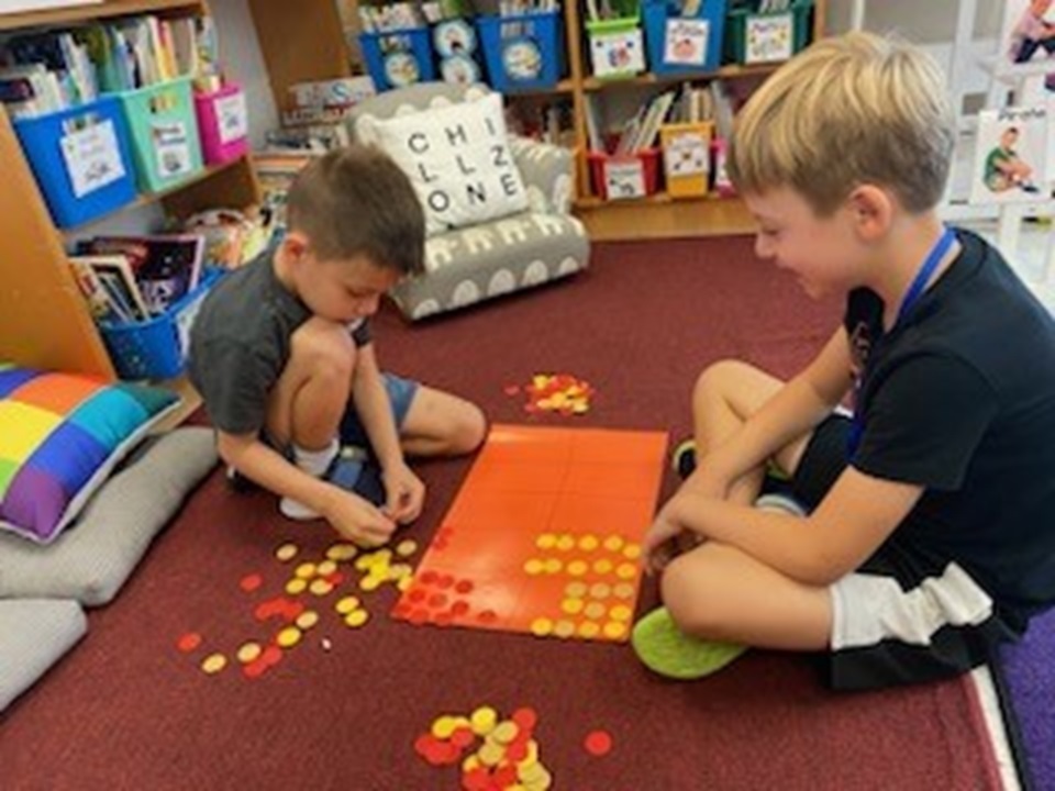 Students working as partners with math manipulatives