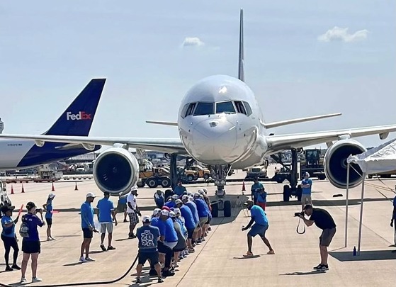 staff pulling a plane