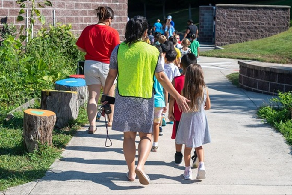 Students and School staff exiting school together