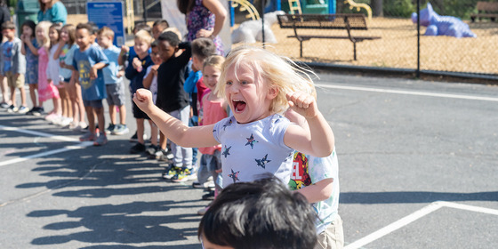 student jumps for joy