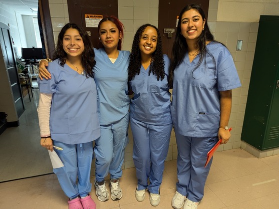 Medical Assistant student in scrubs