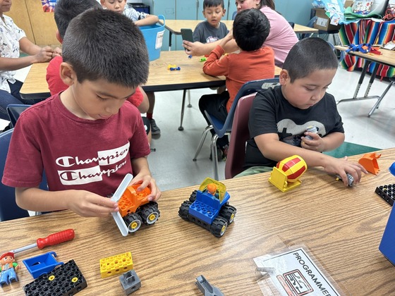 Students building with LEGO