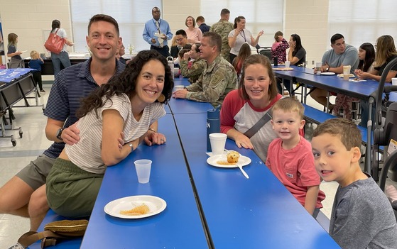 Military families having breakfast at school