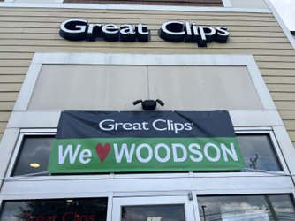 Great Clips We Love Woodson Banner Above the front door