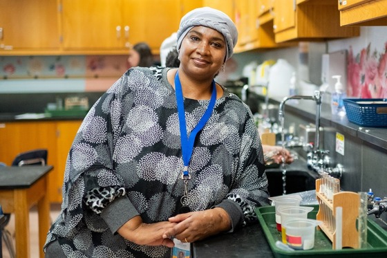 teacher smiling and posing for a photo