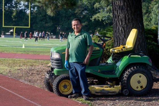 custodian smiling outside