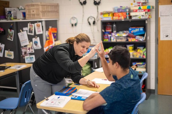 teacher smiling at student