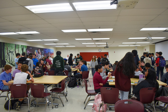 Students enjoying breakfast at National Merit Scholarship celebration in Lecture Hall