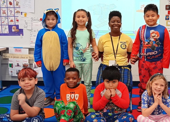 Ms. Lewis's class celebrates their class earning pajama day.