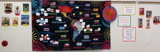 Map of the Hispanic world with names of students and pictures who are from those countries