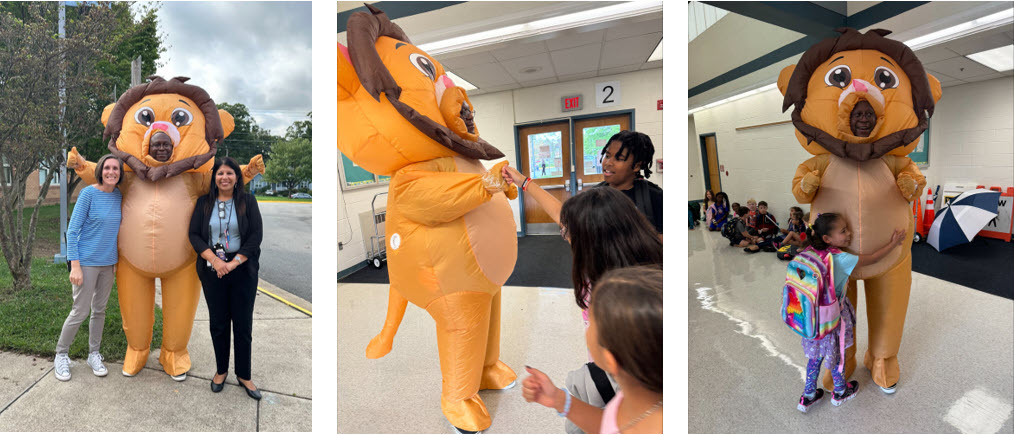 Mr. Dickens dressed in an inflatable lion costume with students and staff members