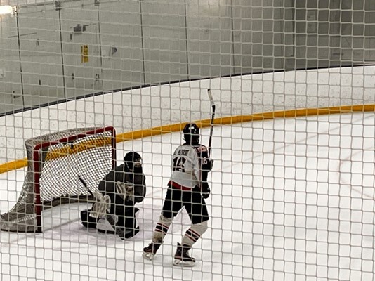 Senior Derek Hanson positions himself in front of the goalie