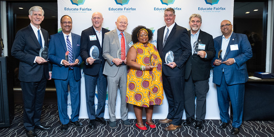 2024 Alumni Honorees lined up with their awards.