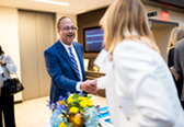 Honoree Tony Perkins shaking hands with another attendee.