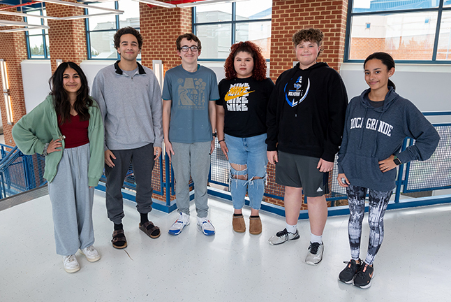 High school students arm in arm.