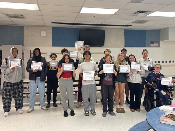 Students posed with their Cav Kudos certificates