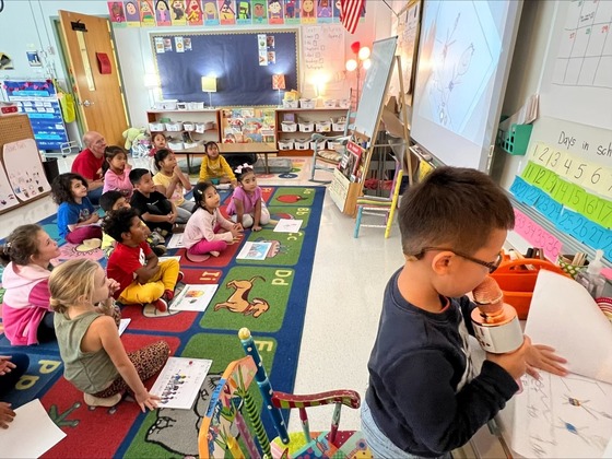 Students read to their class 