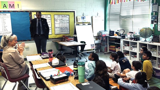 Franconia District Supervisor Rodney Lusk visits a 4th grade classroom to talk with students