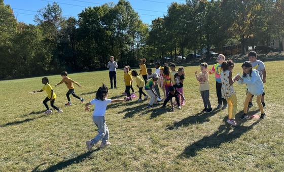 Students running a relay race at Field Day