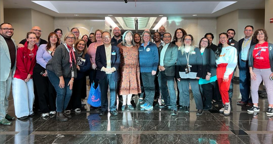 a group of people smiling for a photo