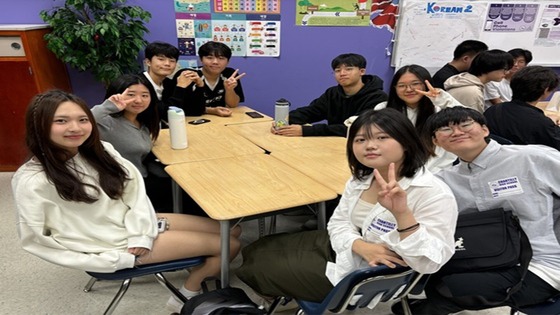 Students from South Korea sitting at desks