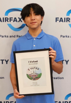 Student holding award