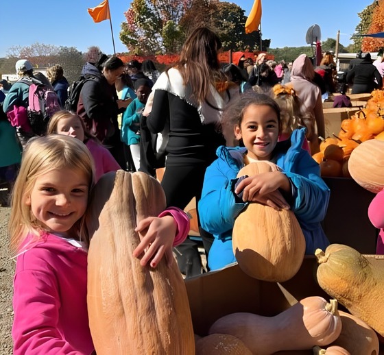 students with pumpkins 