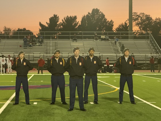 JROTC students standing on the football field