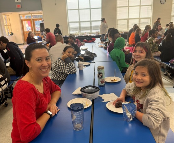 parents and students eating breakfast together at school