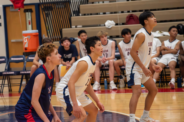 Boys Volleyball players waiting for the serve