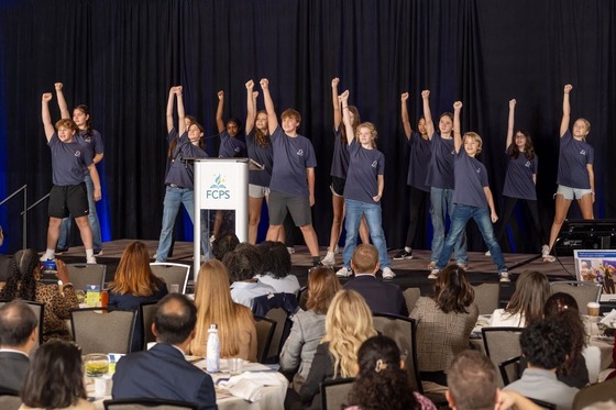 students dancing on stage for a performance