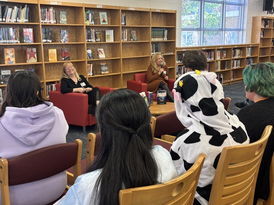 Career Day speakers presenting to students in the library