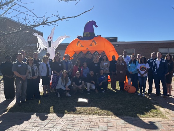 Speakers pose after a successful career day on Halloween!