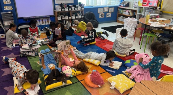 Students in pajamas reading