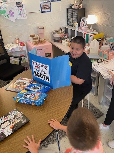 A student voting for his favorite cookie