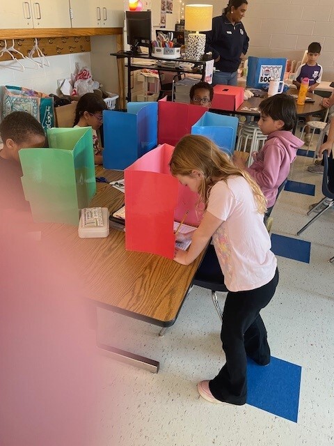 Students voting for their favorite cookies