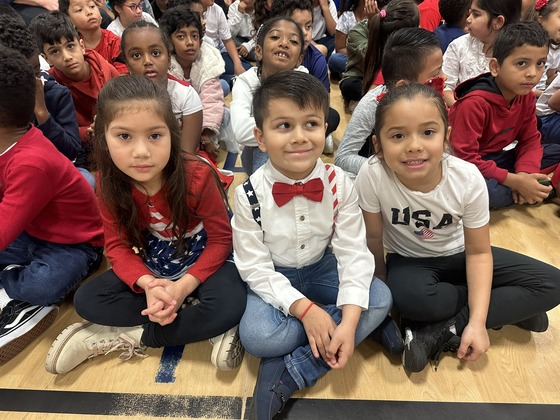 Students wearing red, white and blue at the Veterans Day concert