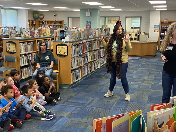 Students listening to a story in the library.