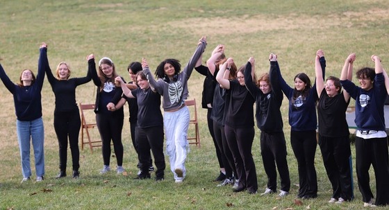 Students celebrating in the park after their play