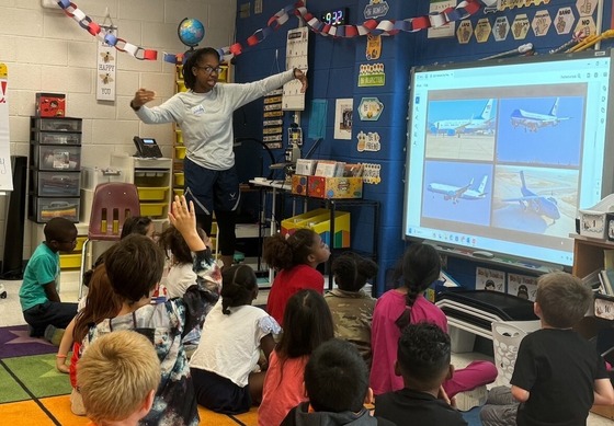 Military parents visiting with students in the classroom