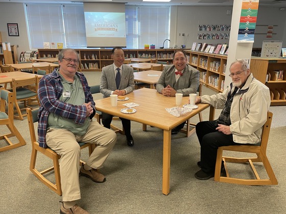 Four Veterans gather around the table during our Veterans Day breakfast 