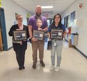 teachers smiling with their awards