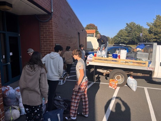 High School students loading supplies onto truck