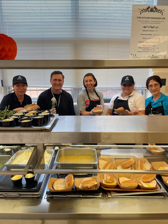 Staff Serving Thanksgiving lunch to students