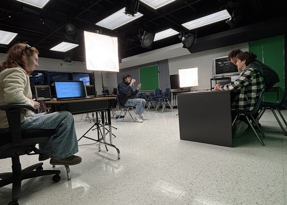 Oceanography students film a class project using the green screens